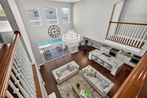 an empty room with windows and ceiling fan