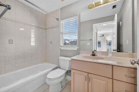 a view of a balcony with wooden floor and fence