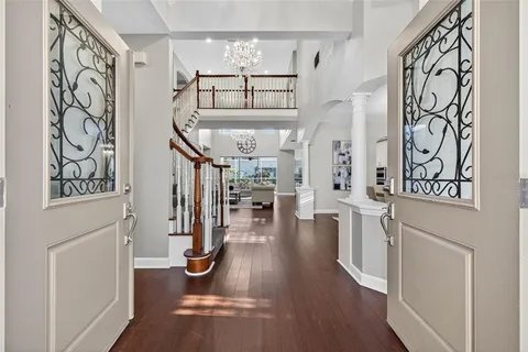 a living room with furniture a fireplace and a large window