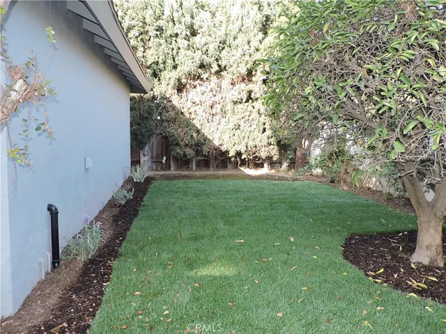 a backyard of a house with lots of green space