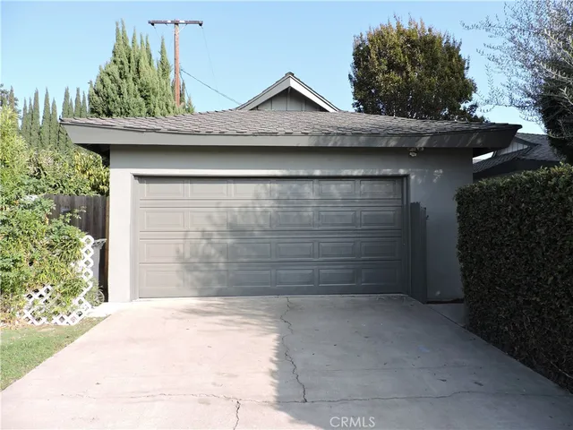 a wooden door in front of a house