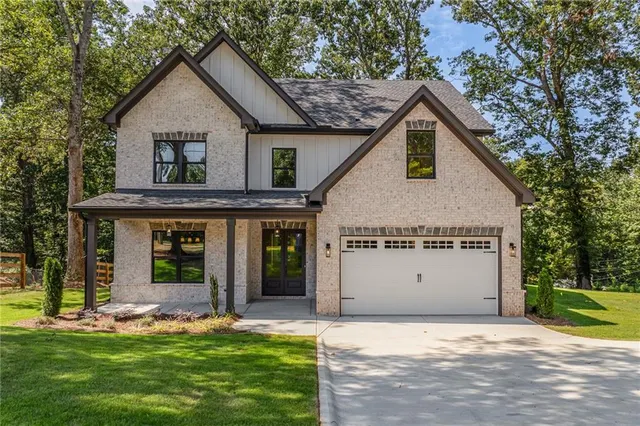 a view of a house with garden and yard
