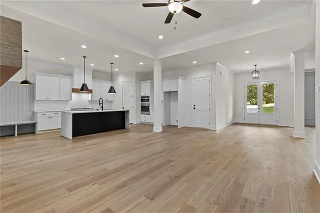a view of a kitchen with a sink and a microwave