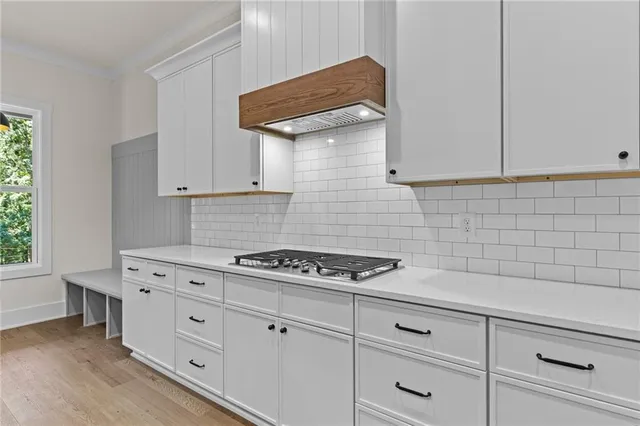 a kitchen with cabinets and appliances