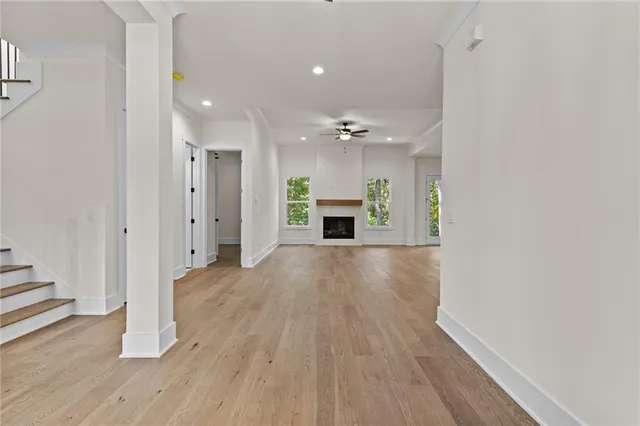 wooden floor in an empty room with a fireplace