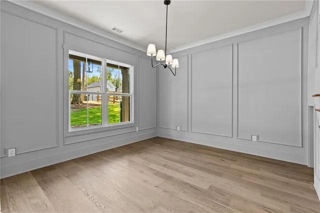 a view of livingroom with window ceiling fan and hardwood floor