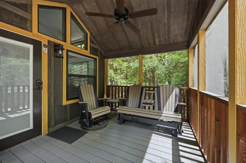 3958 Ranch Road Whitesboro, TX 76273 - Photo 8 of 40 Screened porch with wood-finish flooring, wood plank ceiling, exposed wood beams, and a ceiling fan