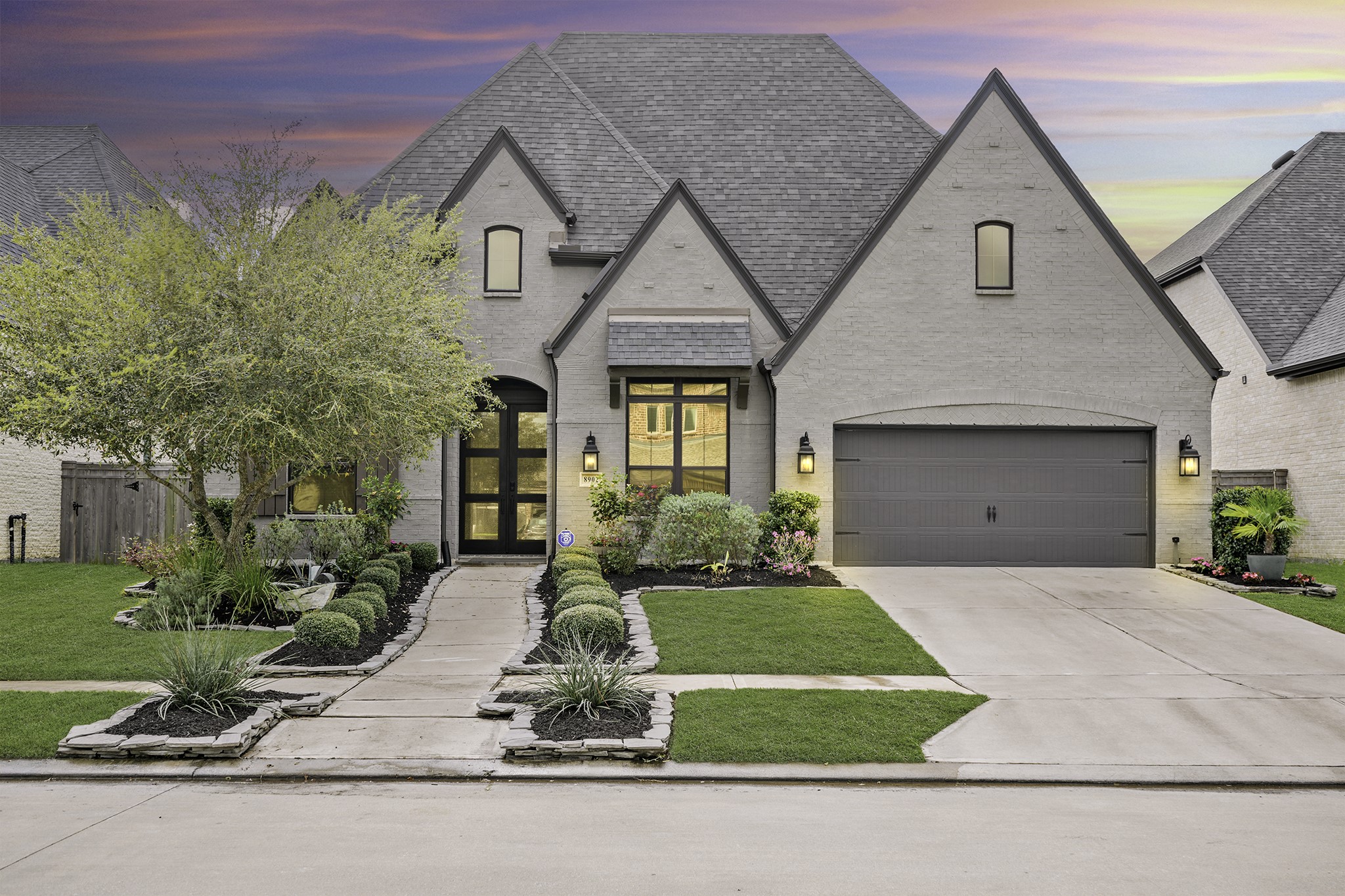 8902 Iron Forge Road Missouri City, TX 77459 - Photo 43 of 44 Twilight view of the home. 3-car tandem garage is climate controlled for cooling and heating.