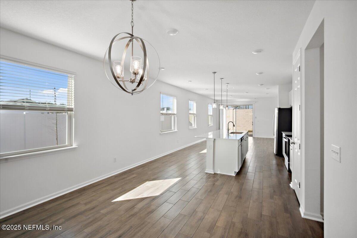7212 Red Timber Road Jacksonville, FL 32244 - Photo 12 of 31 a view of dining room with wooden floor