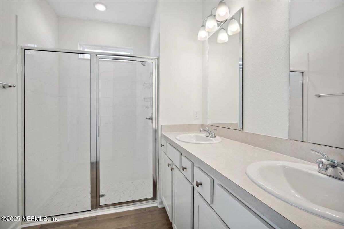 7212 Red Timber Road Jacksonville, FL 32244 - Photo 16 of 31 a bathroom with a double vanity sink and mirror