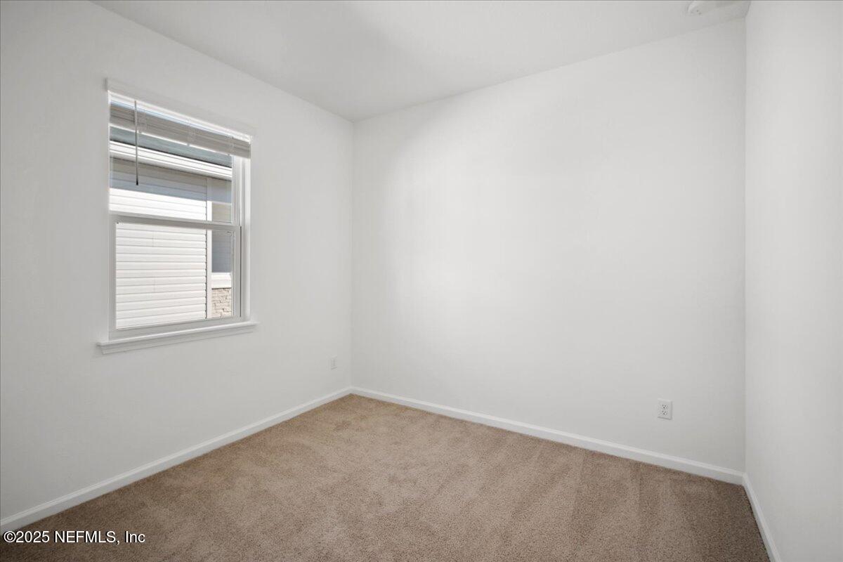 7212 Red Timber Road Jacksonville, FL 32244 - Photo 20 of 31 an empty room with a window