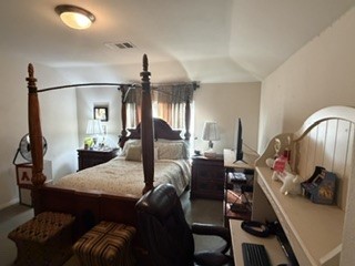 6720 Cromarty Lane Austin, TX 78754 - Photo 21 of 24 A restful bedroom with a classic four-poster bed and practical workspace awaits.