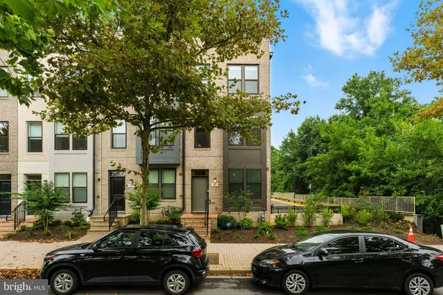 a view of a car parked in front of a cars parked in front of a building