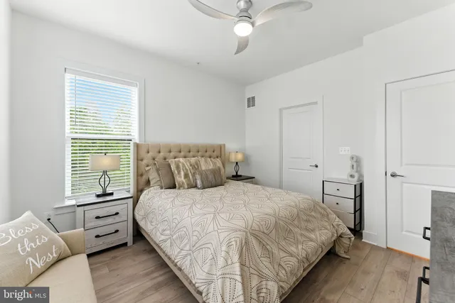 a bathroom with a double vanity sink mirror and toilet