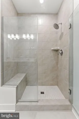 a bathroom with a sink toilet a mirror and shower
