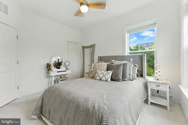 a big room with wooden floor and natural light