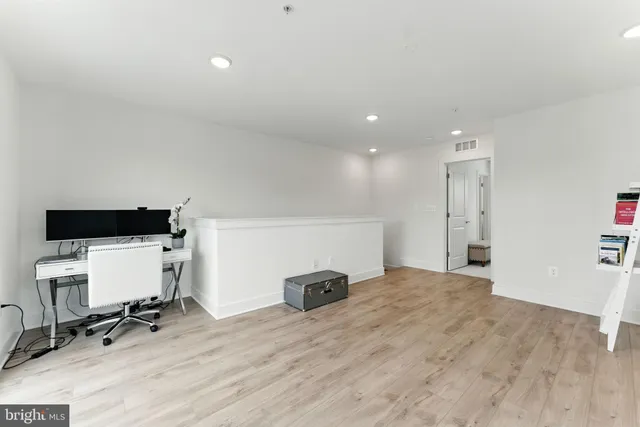 a bedroom with a bed dresser and a window