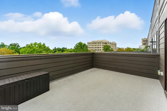 a bathroom with a sink a toilet and a window