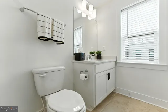 a view of a street with cars on the road