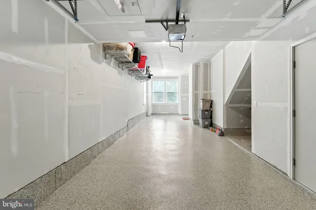 a front view of a building with parked cars