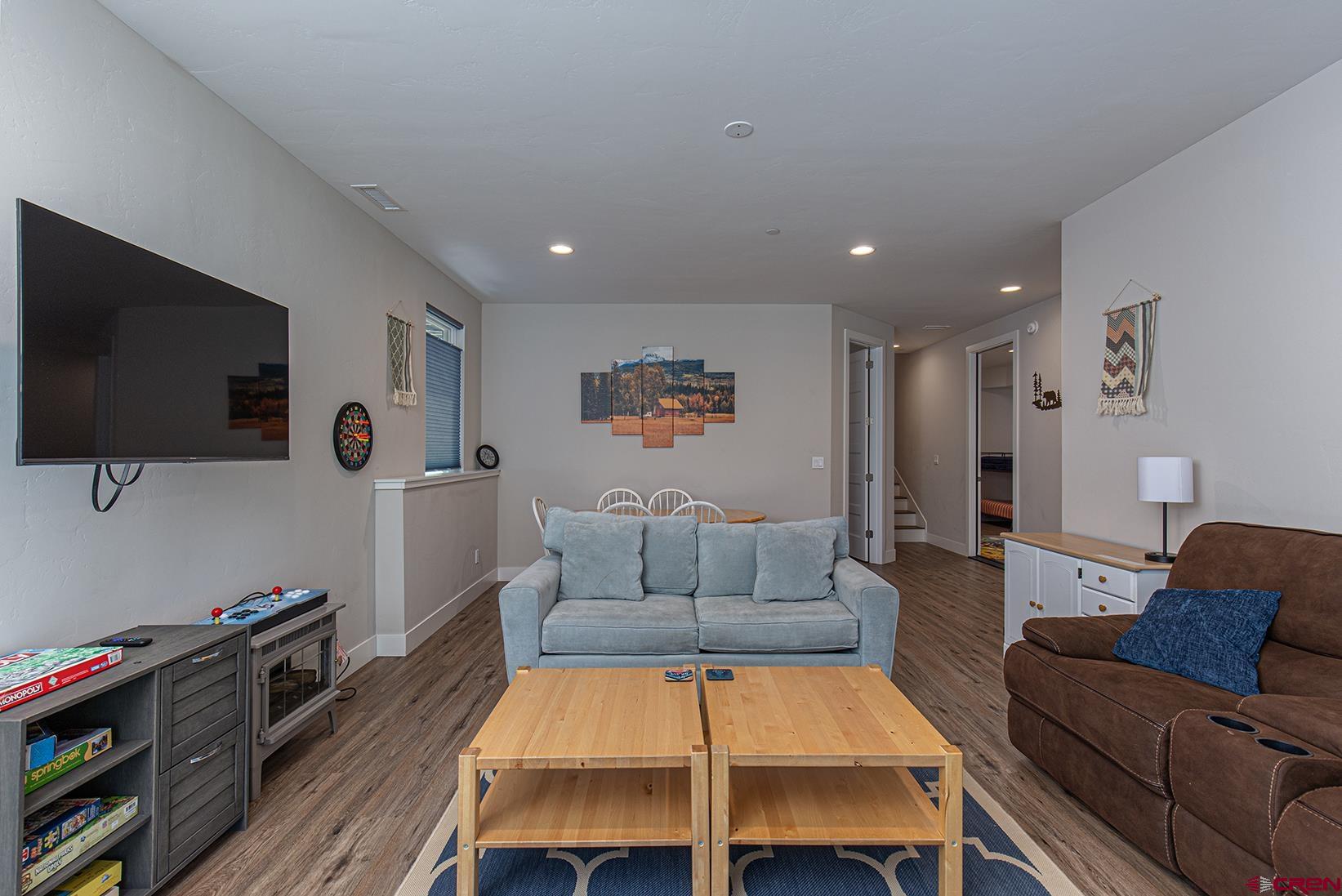 107 Tacoma Drive Durango, CO 81301 - Photo 12 of 29 a living room with furniture and a flat screen tv