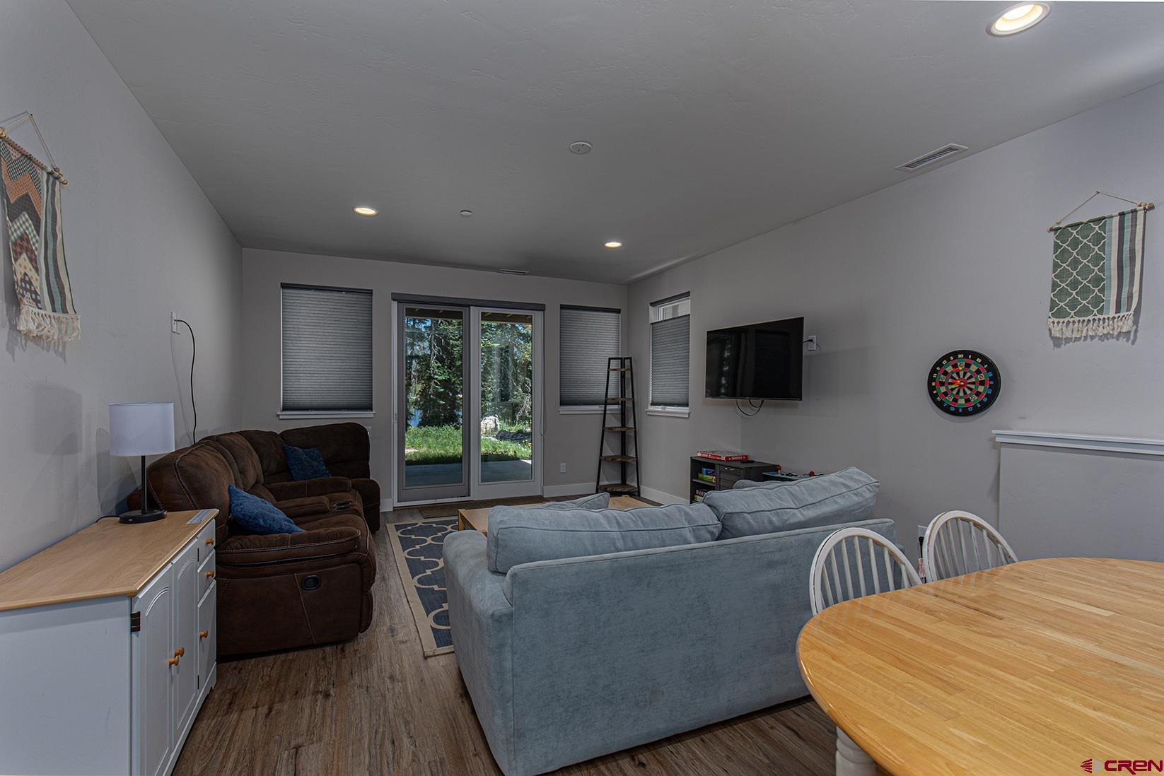 107 Tacoma Drive Durango, CO 81301 - Photo 13 of 29 a living room with furniture and a flat screen tv