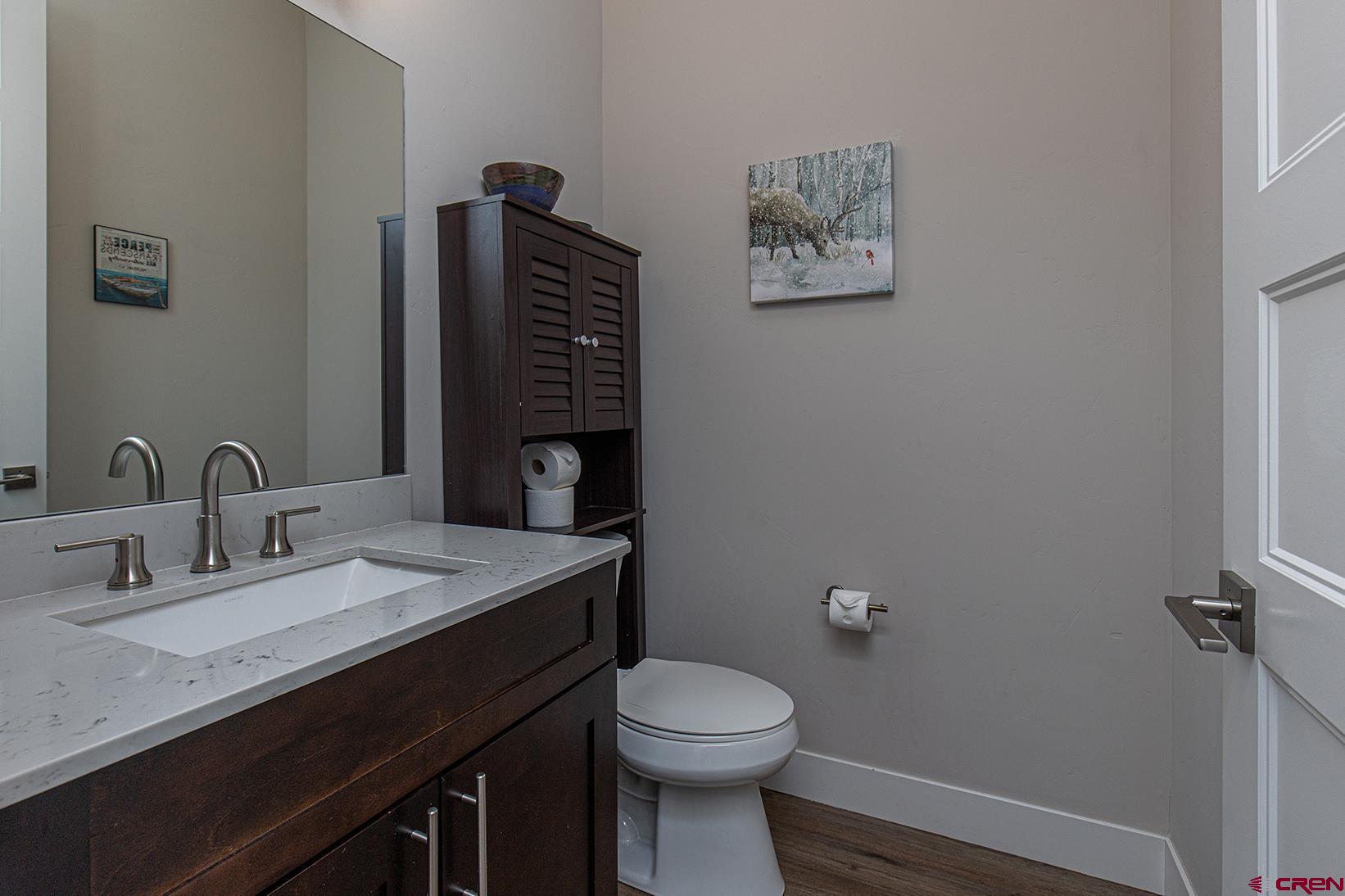 107 Tacoma Drive Durango, CO 81301 - Photo 14 of 29 a bathroom with a granite countertop sink a toilet and a mirror