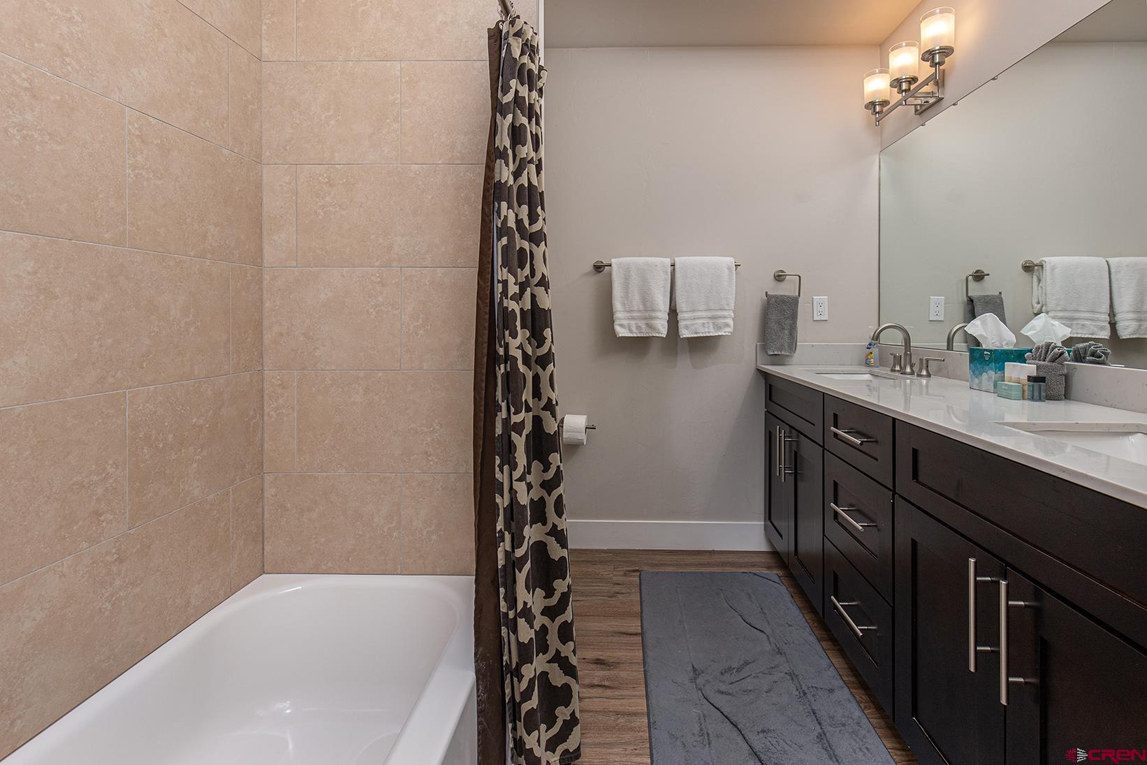 107 Tacoma Drive Durango, CO 81301 - Photo 15 of 29 a bathroom with a bathtub a sink and a shower