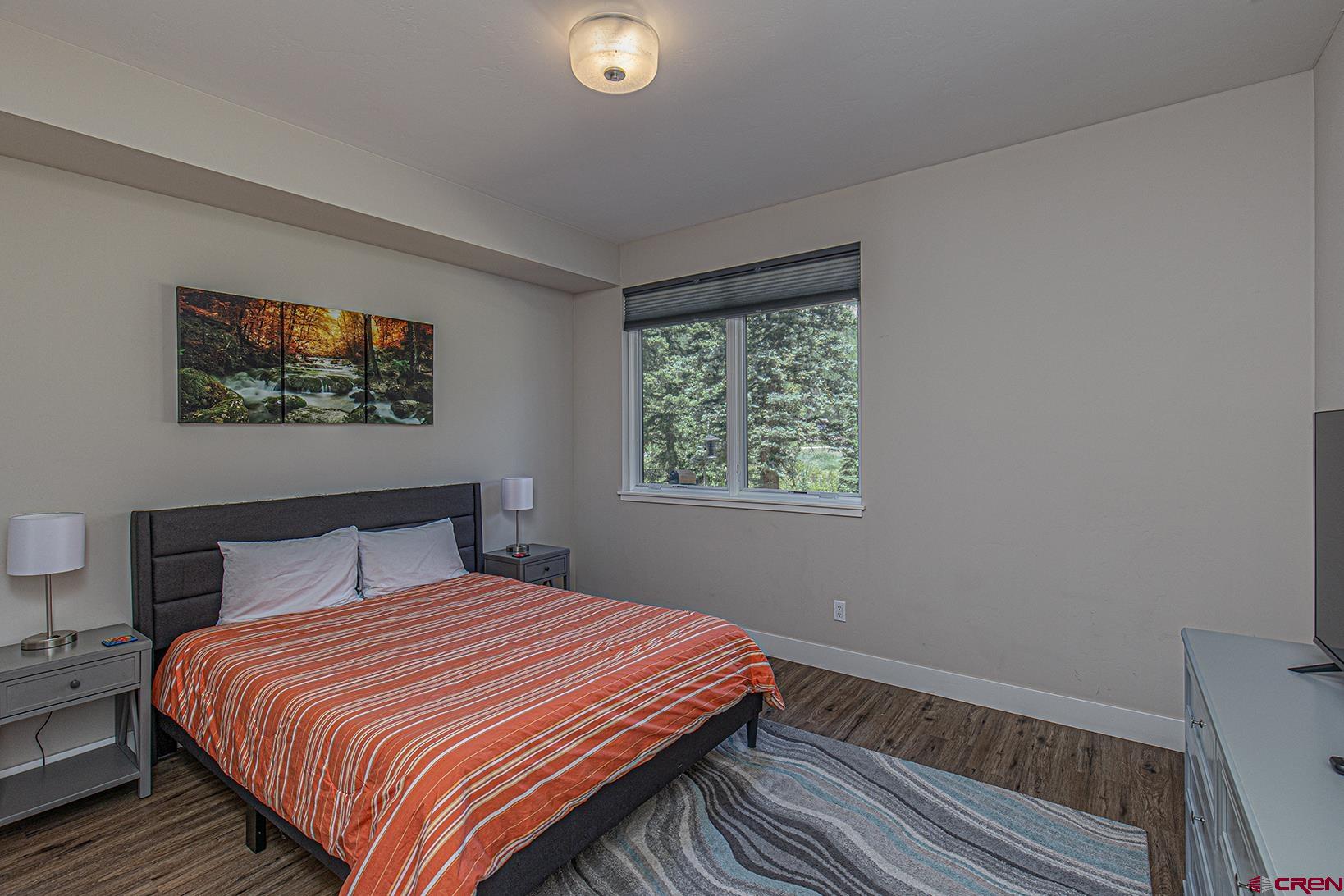 107 Tacoma Drive Durango, CO 81301 - Photo 16 of 29 a bedroom with a bed and a window