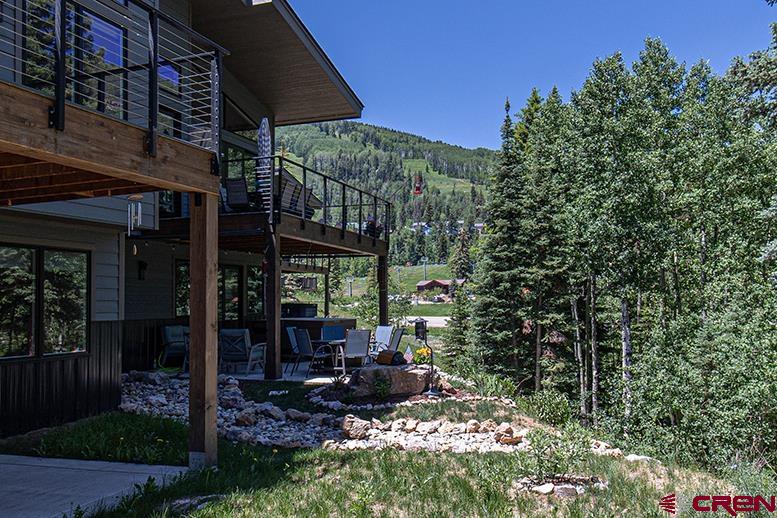 107 Tacoma Drive Durango, CO 81301 - Photo 24 of 29 a view of a chairs and table in backyard