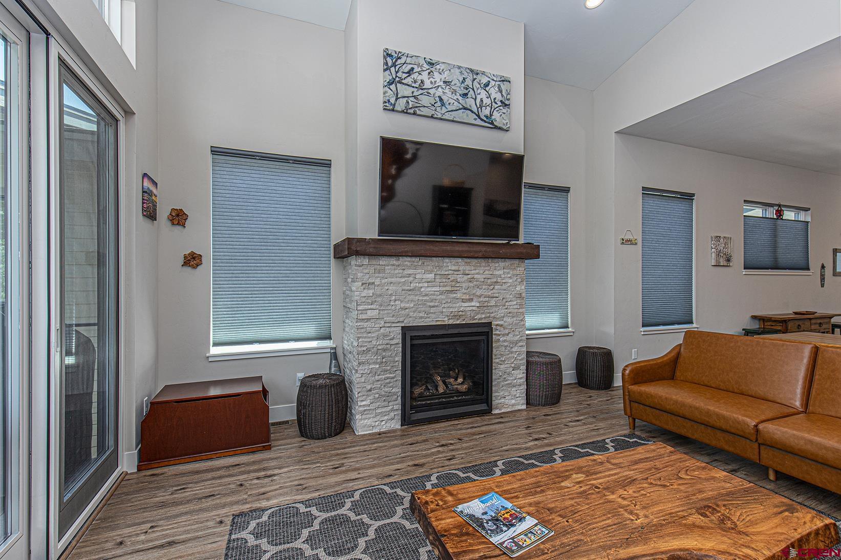 107 Tacoma Drive Durango, CO 81301 - Photo 8 of 29 a living room with furniture and a fireplace