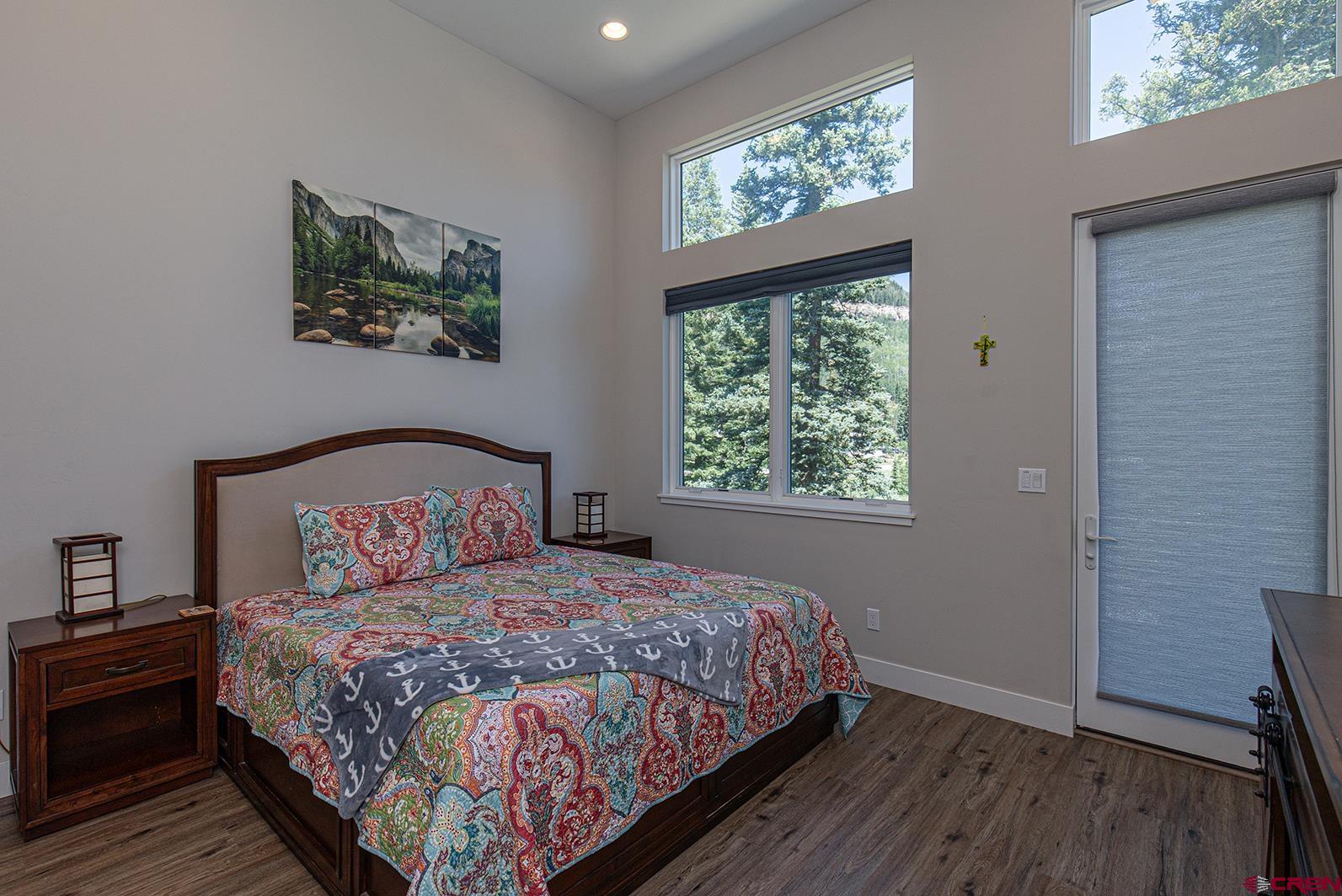 107 Tacoma Drive Durango, CO 81301 - Photo 9 of 29 a bedroom with a large bed and a window
