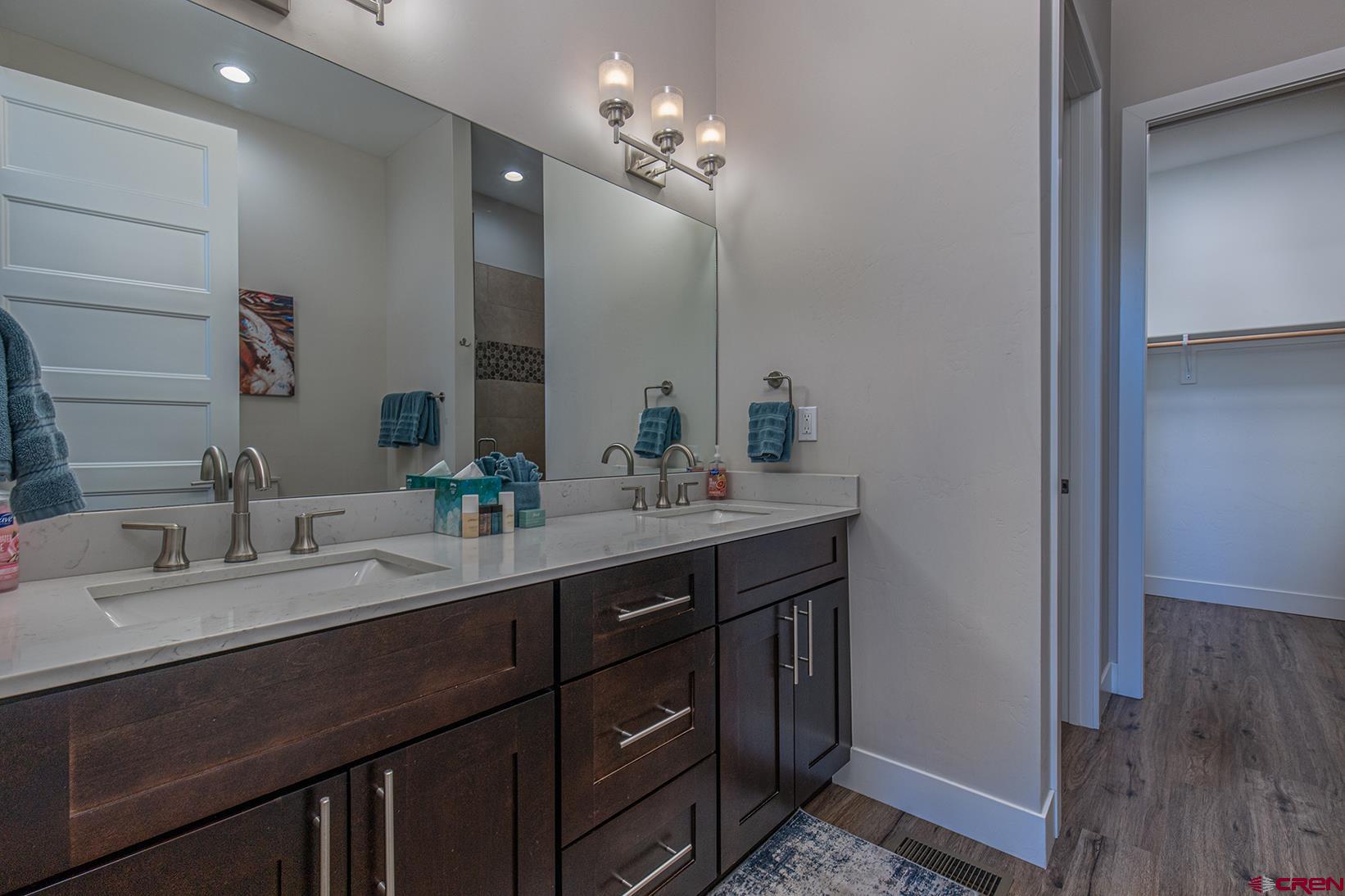 107 Tacoma Drive Durango, CO 81301 - Photo 10 of 29 a bathroom with a double vanity sink and a mirror