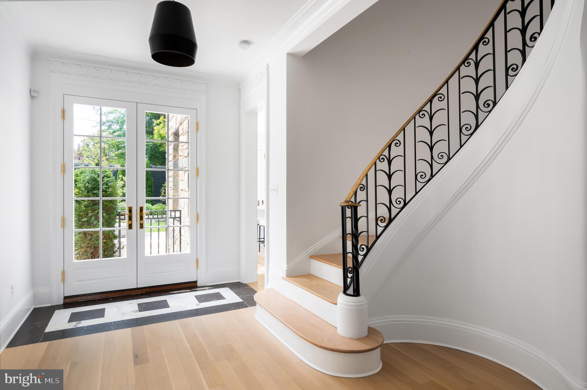 2302 Kalorama Road Northwest Washington, DC 20008 - Photo 13 of 35 Three Sets of French Doors Lead to the Rear Garden