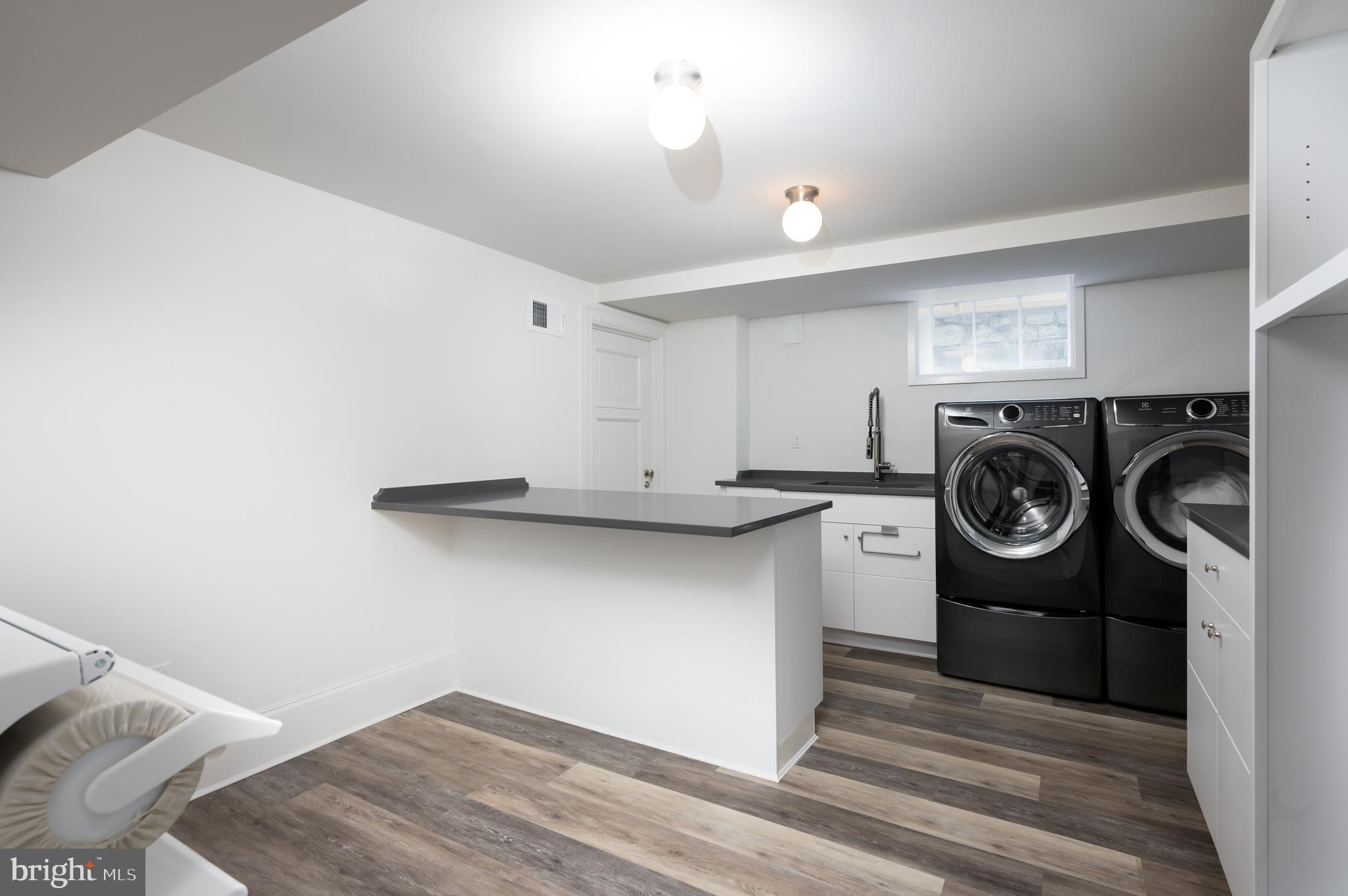 2302 Kalorama Road Northwest Washington, DC 20008 - Photo 30 of 35 Laundry Room with Island and XL Washer/Dryer