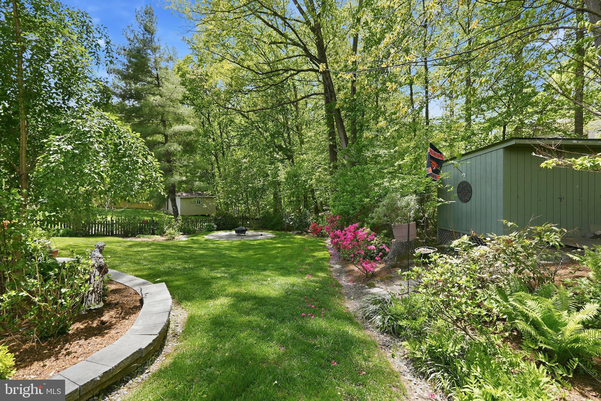 7006 Barnack Drive Springfield, VA 22152 - Photo 52 of 56 a backyard of a house with a yard and outdoor seating