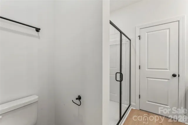 a bathroom with a shower and toilet
