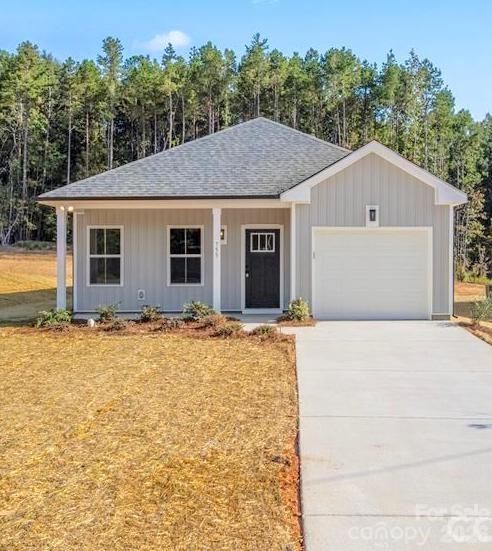 755 Mockingbird Road, Unit 3 Albemarle, NC 28001 - Photo 2 of 26 a front view of house with yard and trees in the background