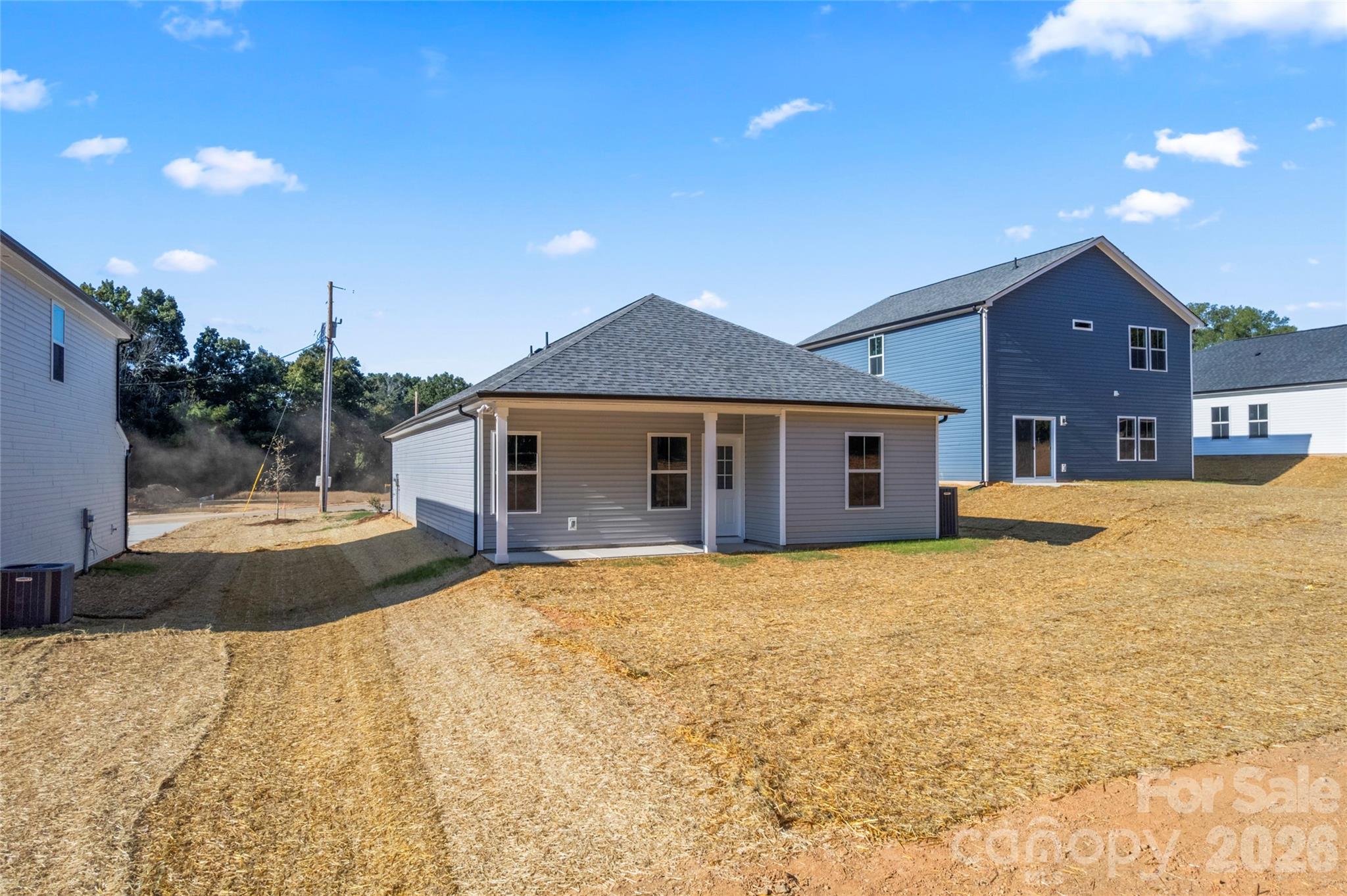 755 Mockingbird Road, Unit 3 Albemarle, NC 28001 - Photo 4 of 25 a front view of a house with a yard