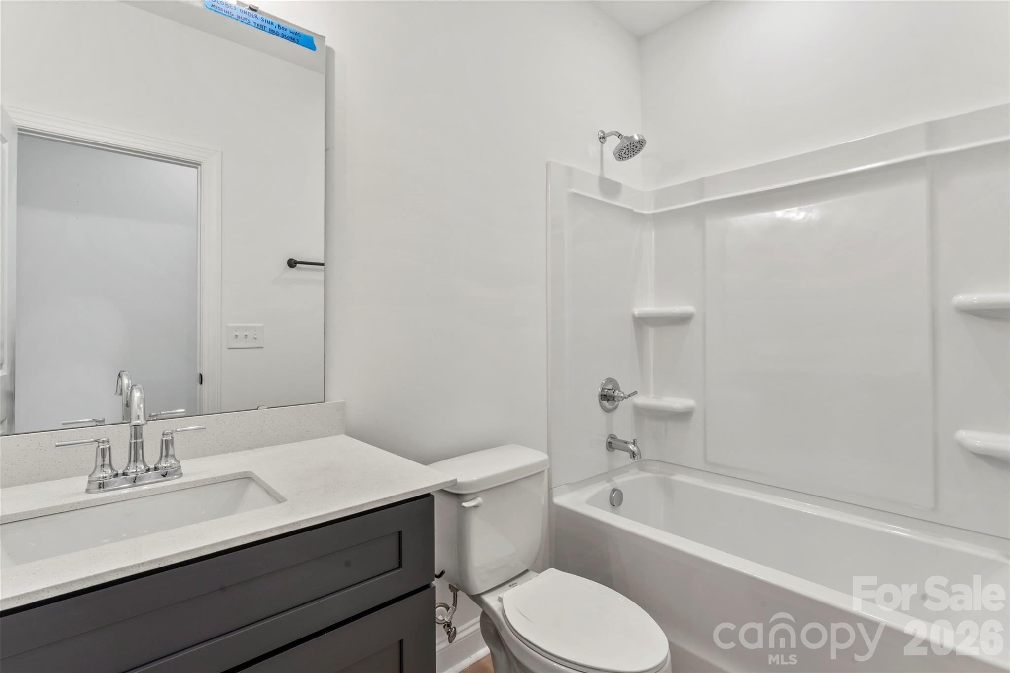 755 Mockingbird Road, Unit 3 Albemarle, NC 28001 - Photo 10 of 26 a bathroom with a sink a toilet and shower