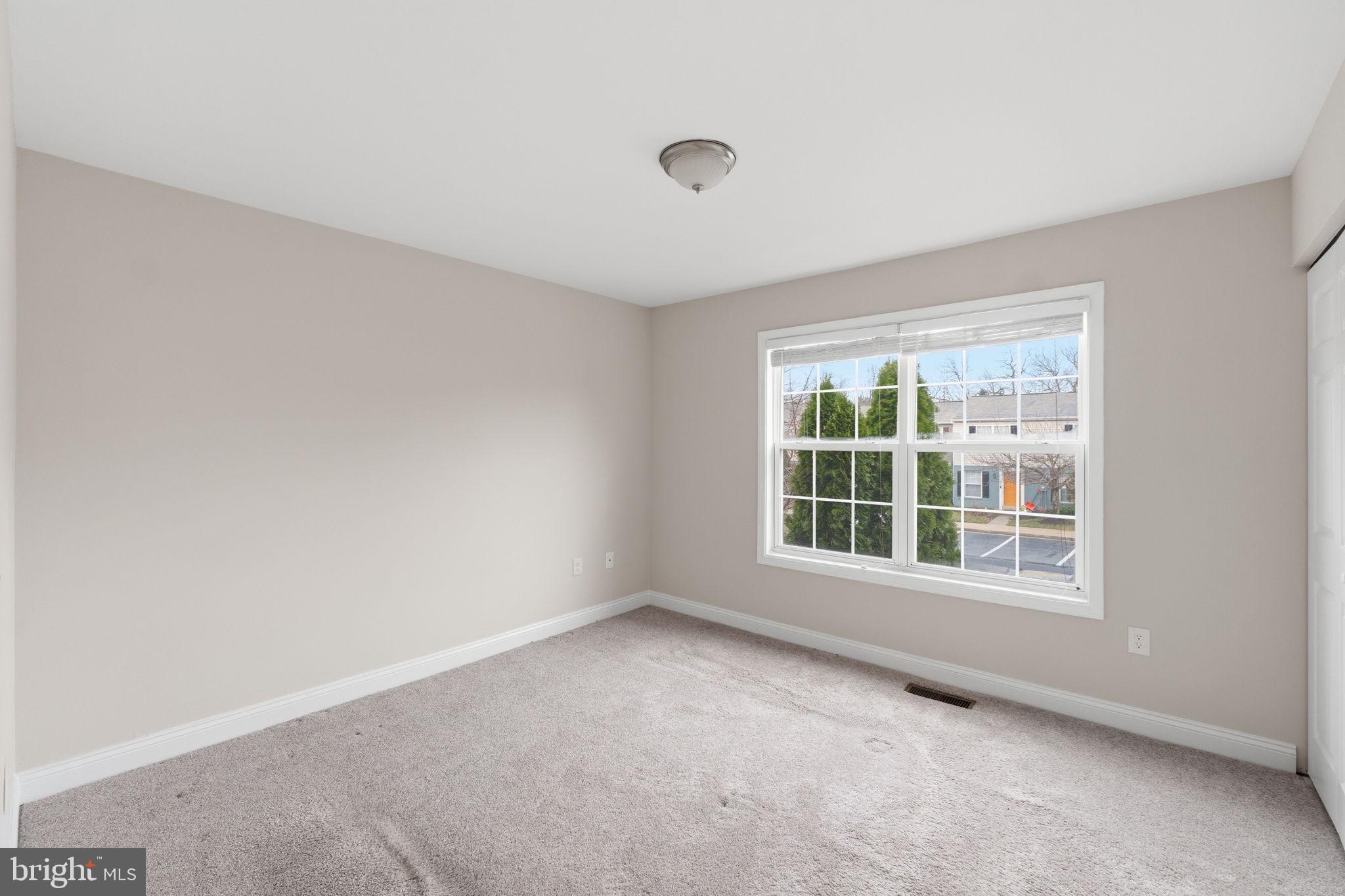 524 Lancaster Place, Unit 524 Frederick, MD 21703 - Photo 13 of 28 an empty room with a window