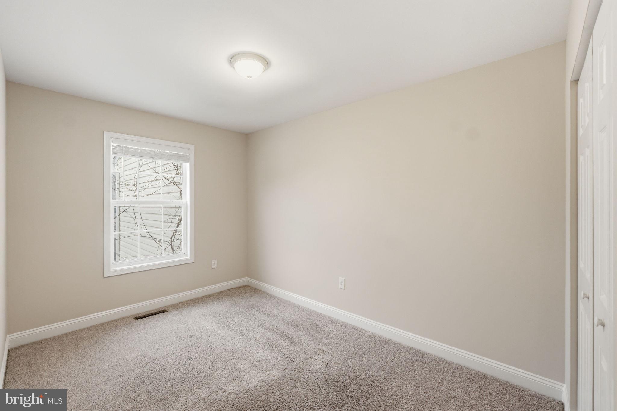 524 Lancaster Place, Unit 524 Frederick, MD 21703 - Photo 18 of 28 an empty room with a window
