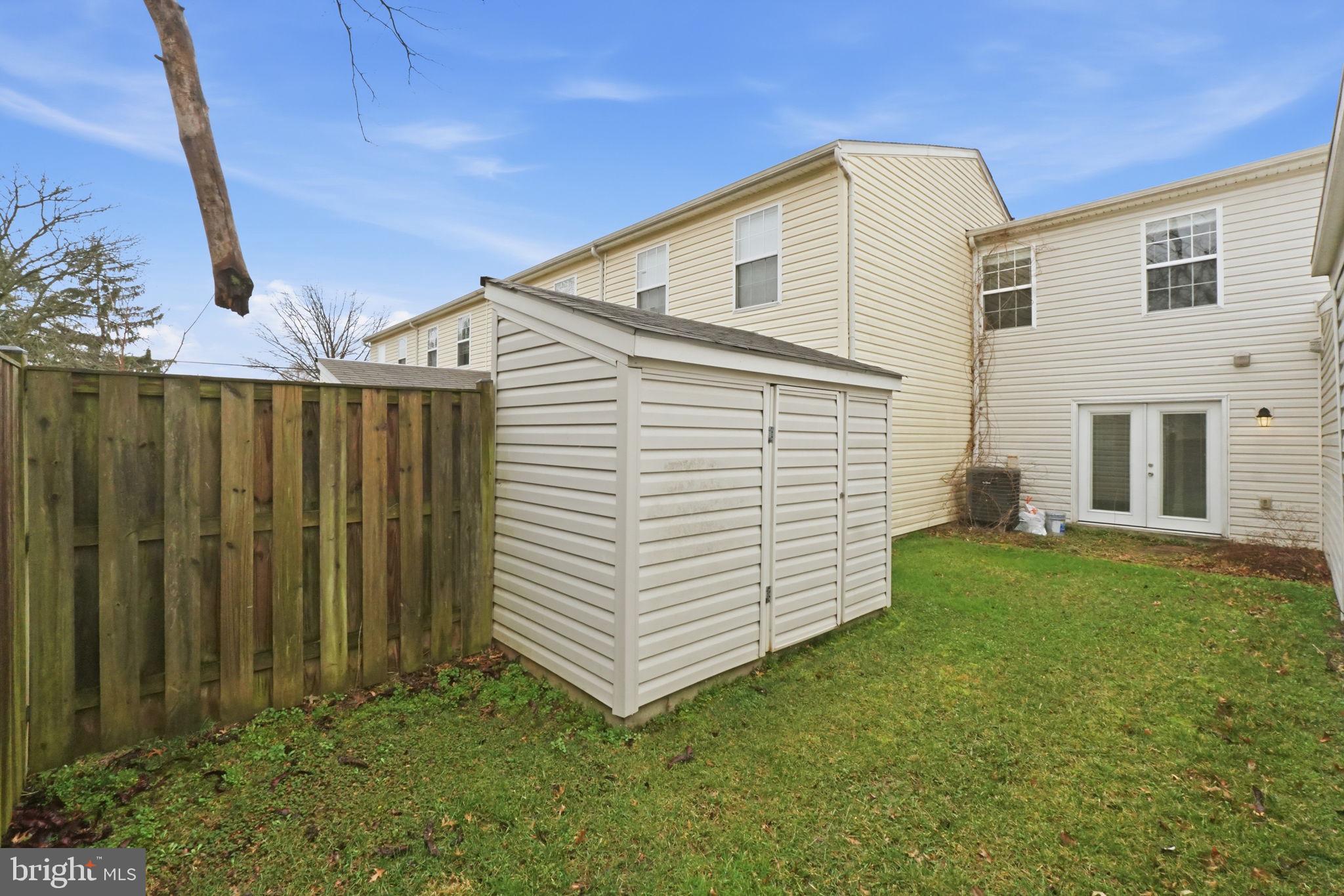 524 Lancaster Place, Unit 524 Frederick, MD 21703 - Photo 25 of 28 a view of a house with a yard