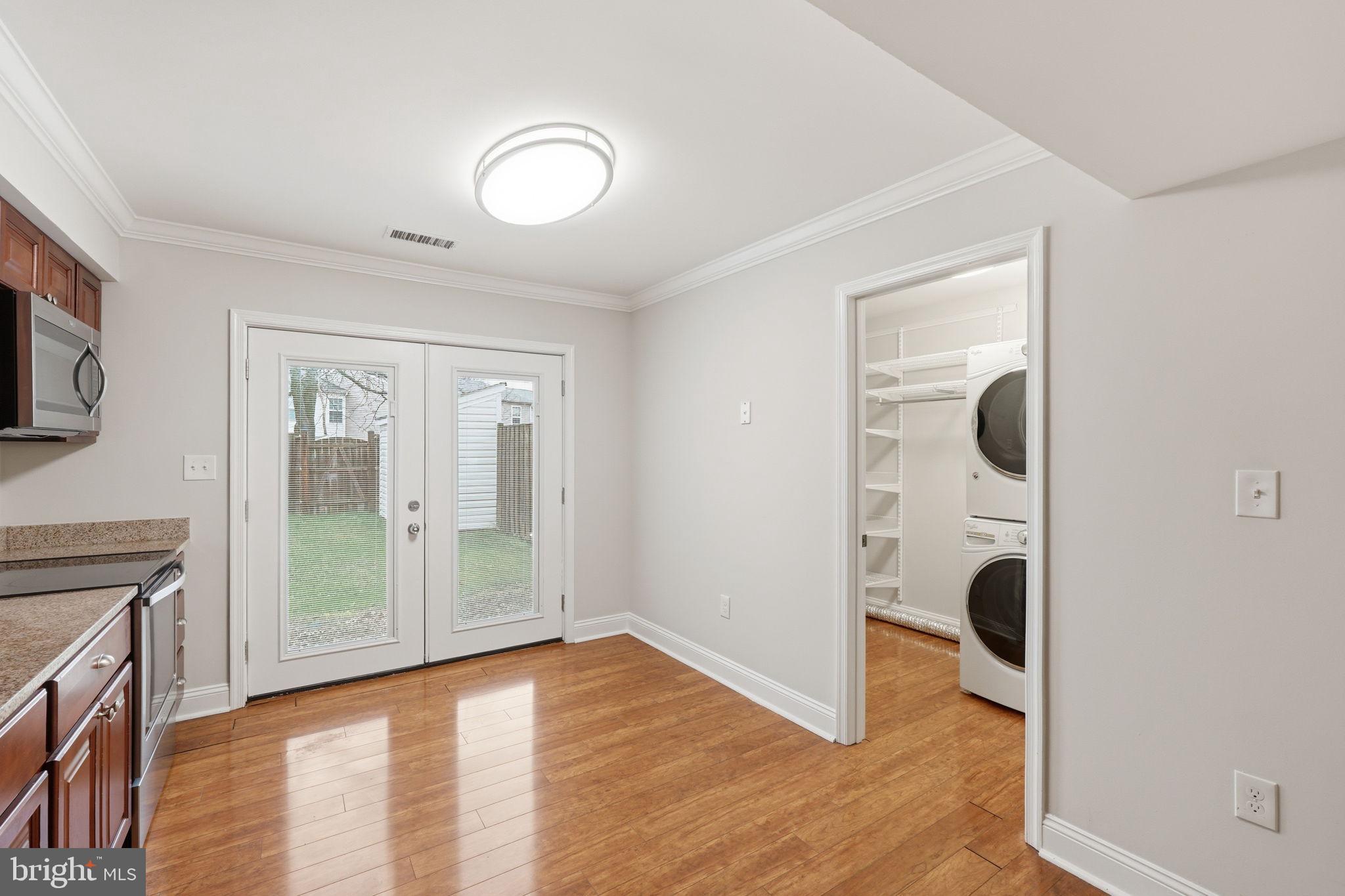 524 Lancaster Place, Unit 524 Frederick, MD 21703 - Photo 9 of 28 a view of a livingroom with wooden floor and furniture