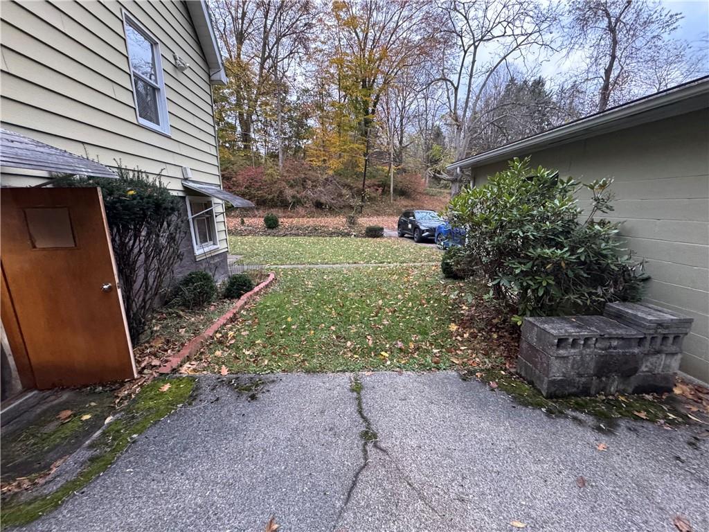 31 Orr Road West Newton, PA 15089 - Photo 23 of 48 a view of a backyard with plants and a fountain