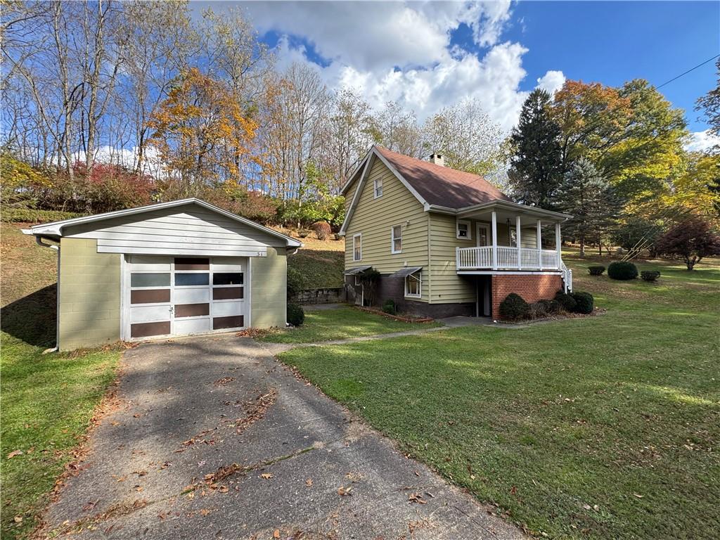 31 Orr Road West Newton, PA 15089 - Photo 26 of 48 a front view of a house with a garden and trees