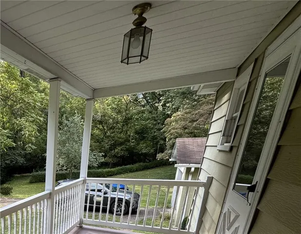 a view of a house with a yard and a garden