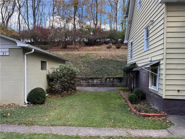 a backyard of a house with lots of green space