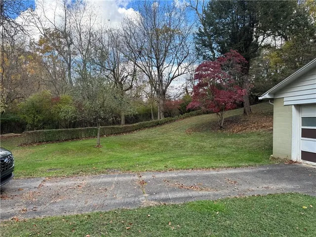 a backyard of a house with lots of green space