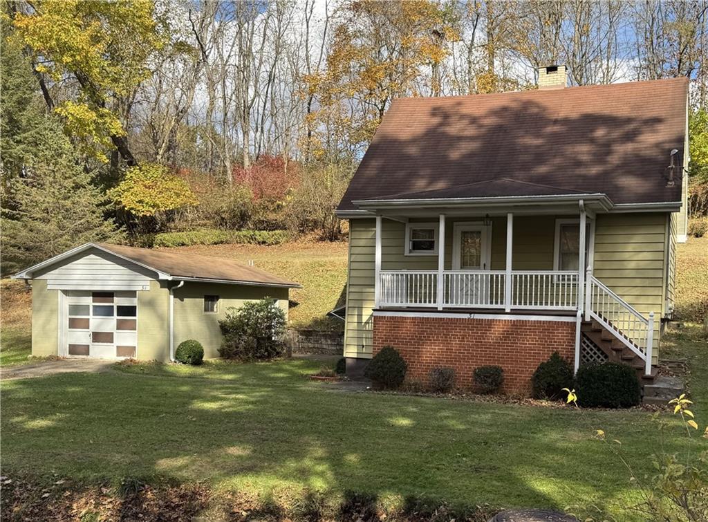 31 Orr Road West Newton, PA 15089 - Photo 46 of 48 a front view of a house with a garden and yard